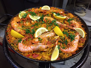 This is a photo of a paella from Big Pans People Paella company. 